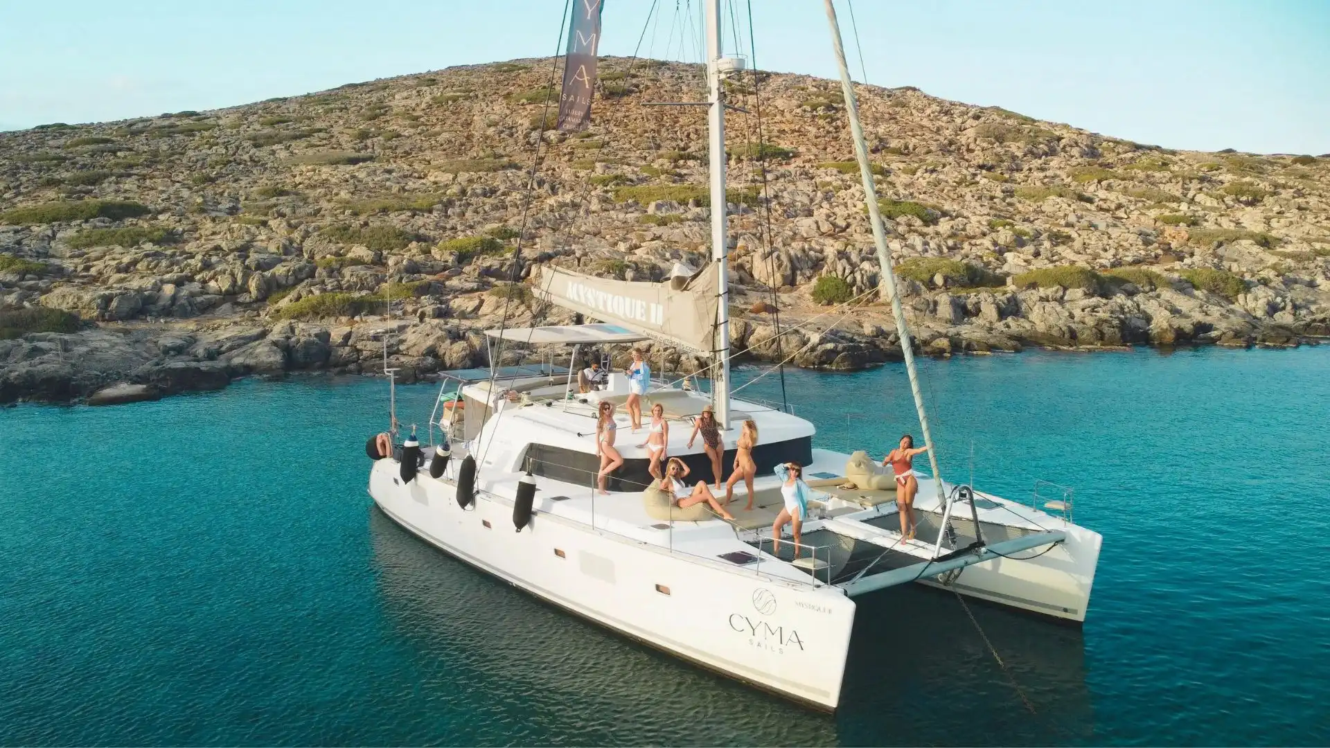Cyma Sails catamaran hosting a Heraklion luxury sailing cruises experience in the clear waters of Crete