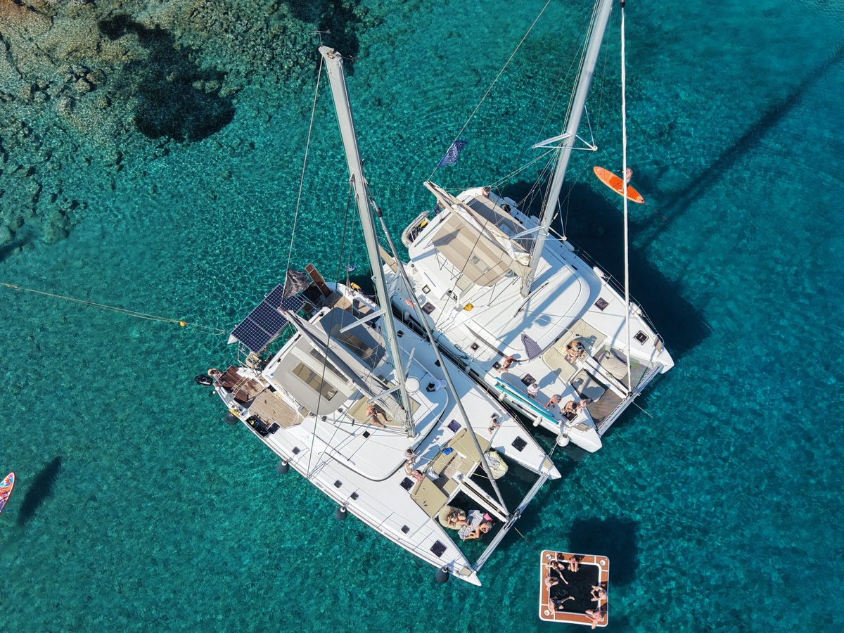 Private catamaran cruise in Crete near Dia Island with clear turquoise water